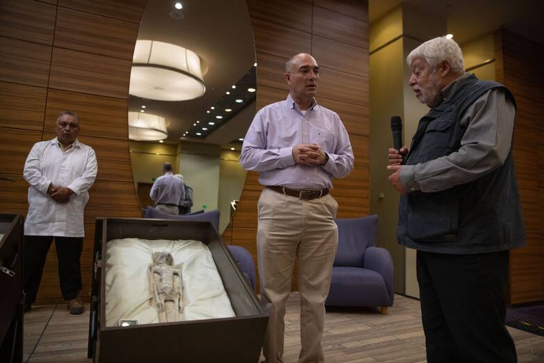 MEXICO CITY, MEXICO - SEPTEMBER 13: Jose de Jesus Zalce Benitez, Director of the Scientific Institute for Health of the Mexican navy is interviewed by Mexican journalist and UFO expert, Jaime Maussan, during a press conference where two 'non-human' beings were displayed to the media, at the Camino Real hotel, in Mexico City, Mexico on September 13, 2023. The press conference was holding the day after the country's first public congressional hearing on the topic with UFO experts. The bodies displayed in cases, have three fingers on each hand they were recovered in Peru in 2017, they have no relation to human beings, experts said. (Photo by Daniel Cardenas/Anadolu Agency via Getty Images)