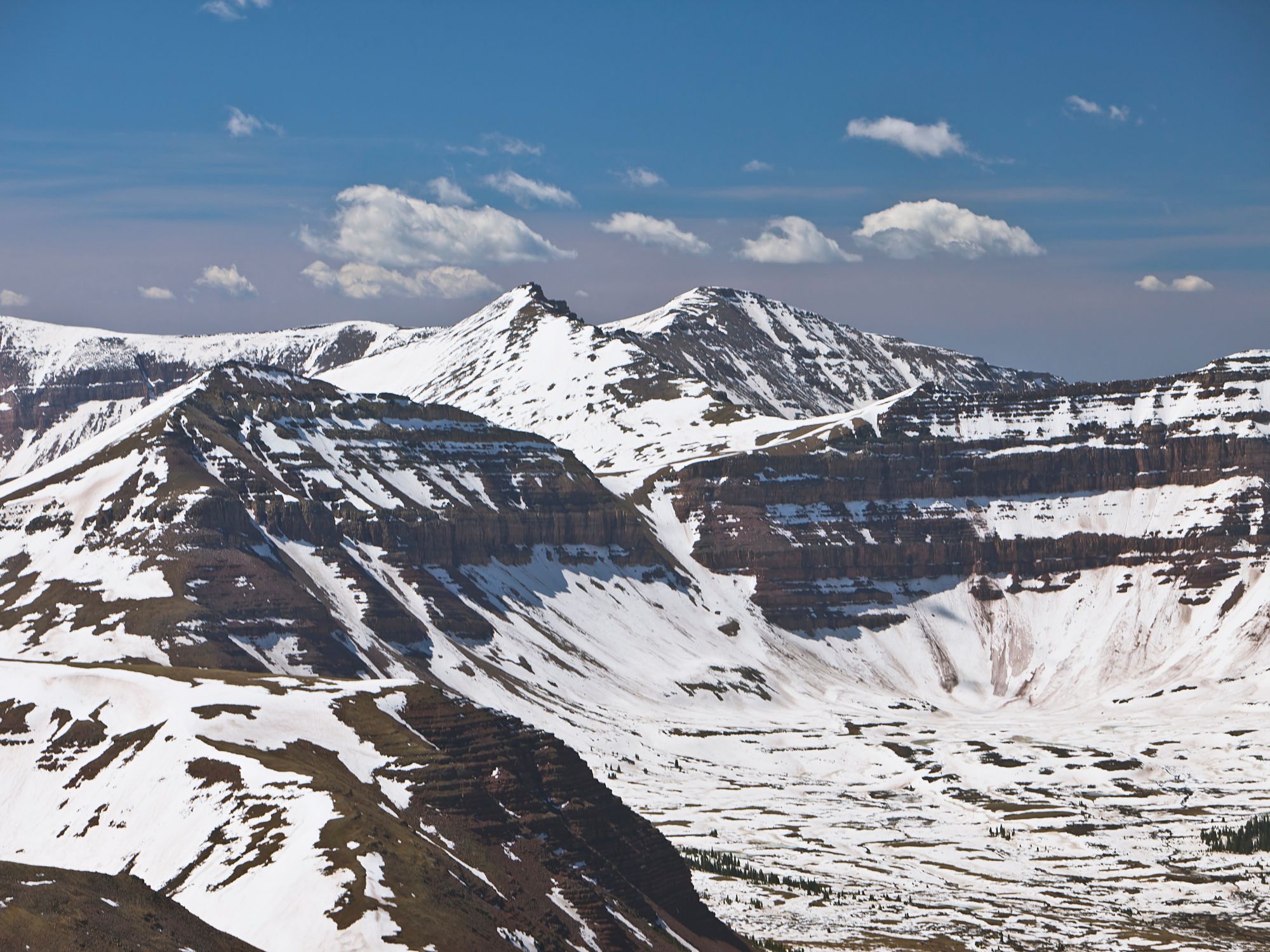 Snow dusted rocky mountains.