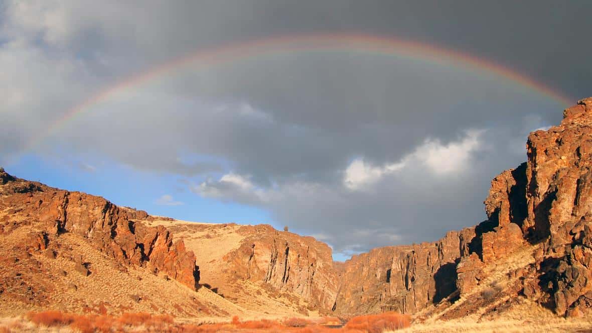 A rainbow arches over the Owyhee Canyonlands wilderness area. Photo: ohn Wirt, USGS. Public domain.