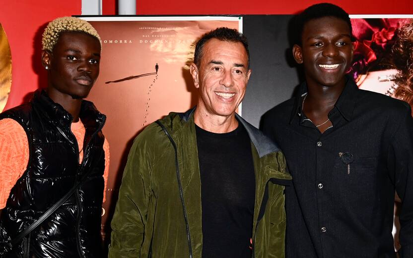 TURIN, ITALY - OCTOBER 3: (L-R) Actor Moustapha Fall, Italian director Matteo Garrone and Musician Seydou Sarr attends during "Io, Capitano" Photocall on October 3, 2023 in Turin, Italy. (Photo by Stefano Guidi/Getty Images)