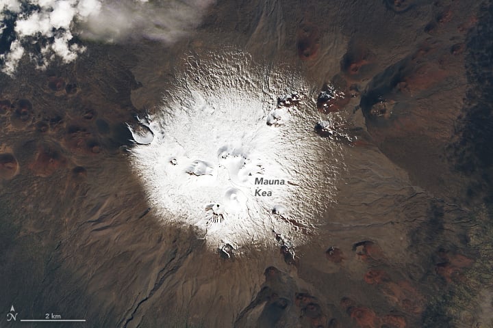 Snow blanketing the peak of a volcano in Hawaii as seen in this satellite image.