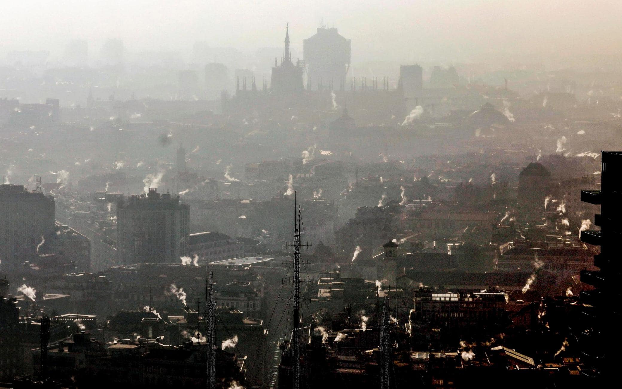 epa08112396 Smog hangs over Milan, Italy, 08 January 2020. According to reports, the Region of Lombardy closed traffic in the cities as Milan, for the most polluting cars, including standards of euro 4, due to exceeded levels of microparticles with over 50 micrograms per cubic metre. EPA/MOURAD BALTI TOUATI