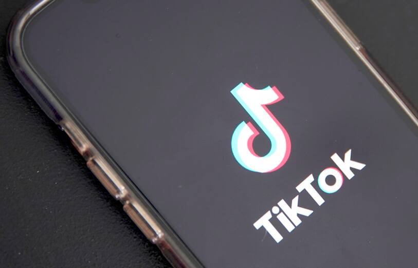 epa10635395 In this photo illustration the TikTok logo is displayed on a phone in Los Angeles, California, USA, 17 May 2023. Govenor Greg Gianforte of Montana signed a measure that bans the TikTok app in the state. EPA/CAROLINE BREHMAN