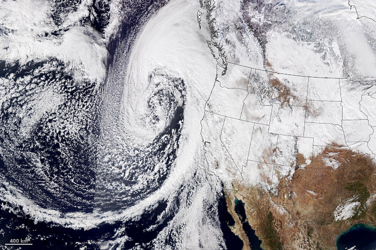 A true color satellite image showing an atmospheric river off the coast of California. 