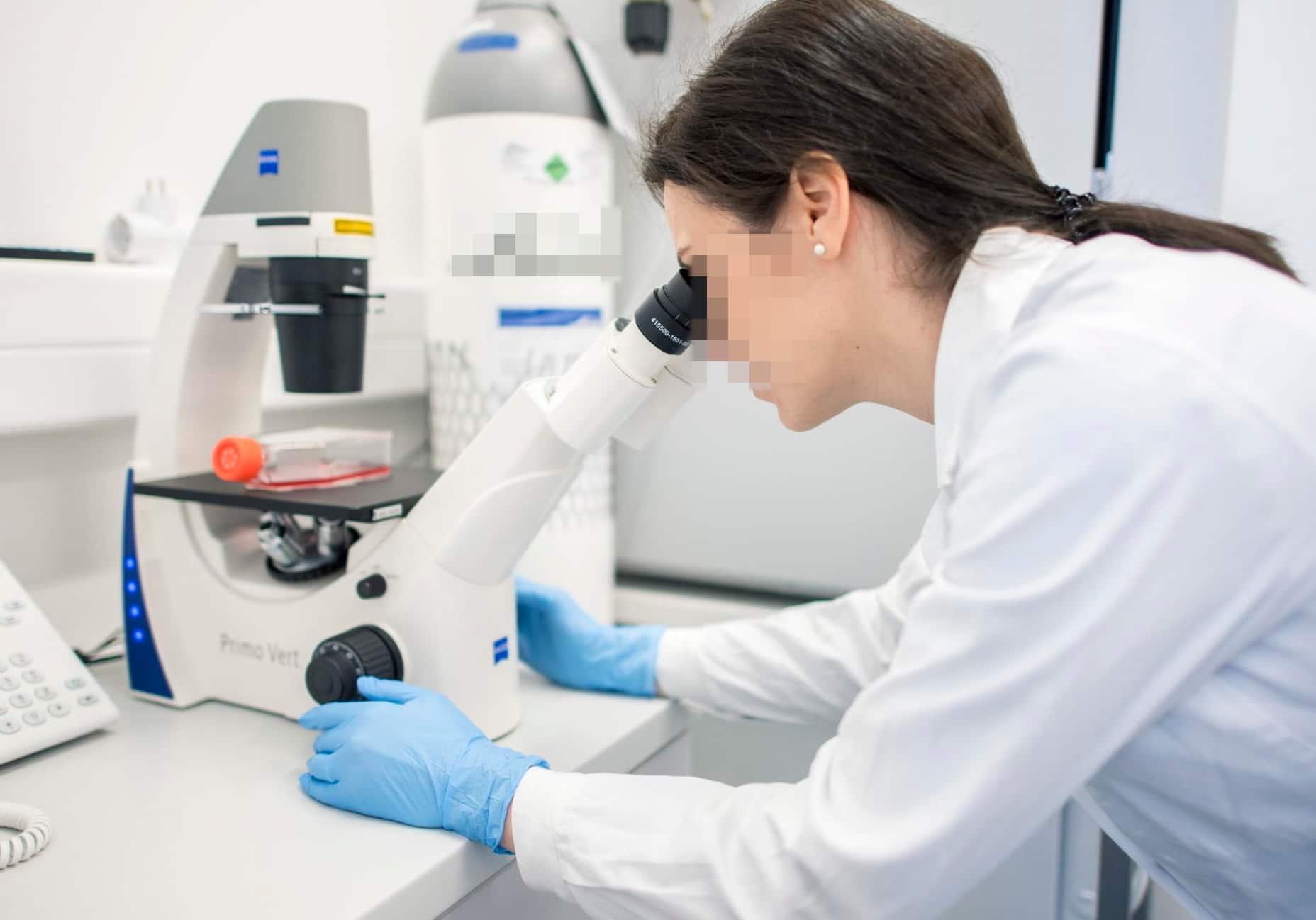 epa08200482 A fellow of the virological research group of Szentagothi Research Centre of the University of Pecs uses a microscope to monitor cells in the centre's laboratory in Pecs, Hungary, 07 February 2020. The main profile of the research group is the research of viral zoonoses (diseases that are spread from animals to humans caused by viruses), and as novel coronavirus is also a virus spreading from animals to humans the centre is prepared to carry out researches concerning the deadly coronavirus if this activity becomes neccessary. EPA/Tamas Soki HUNGARY OUT