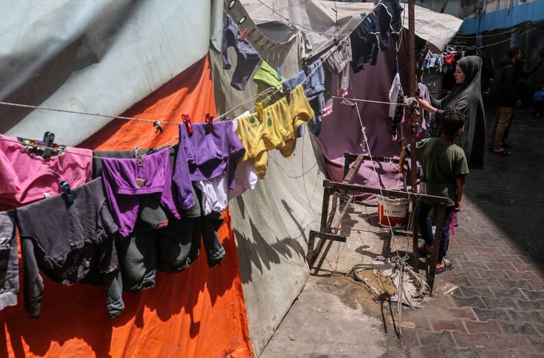 Displaced Palestinians are sheltering in a UNRWA-affiliated school after fleeing their homes due to Israeli strikes, amid the ongoing conflict between Israel and Hamas, in Deir Al-Balah, in the central Gaza Strip, on April 23, 2024. (Photo by Majdi Fathi/NurPhoto via Getty Images)