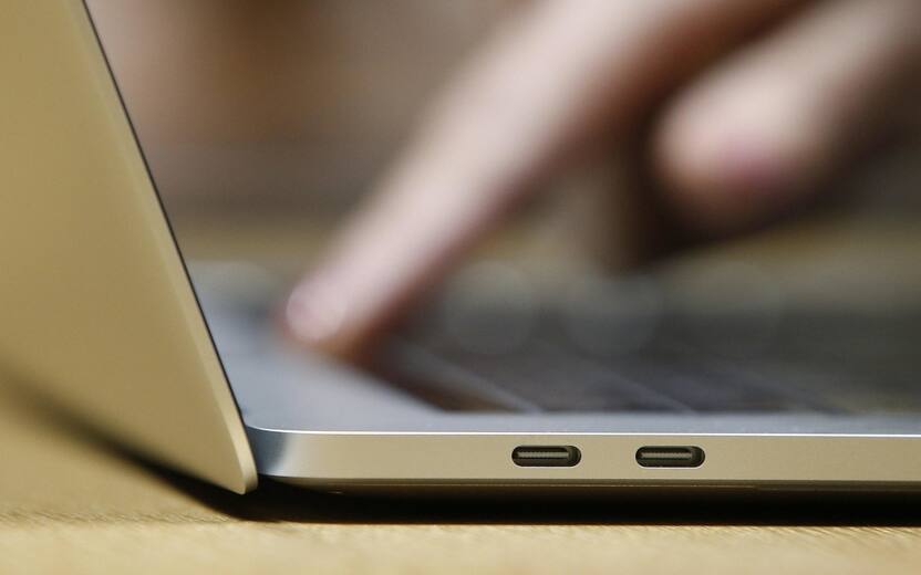 epa06417905 (FILE) - A guest inspects the new MacBook Pro computer with the new USB-C ports in a demo room, following the announcement of new products at the Apple Headquarters in Cupertino, California, USA, 27 October 2016 (reissued 05 January 2018). According to reports, Apple has admitted its iPhone and Mac products are affected by two considerable security flaws in the hardware chips. Several technology companies are rushing to fix two considerable flaws in popular computer chips manufactured by Intel, AMD and ARM. The flaws could help attackers to gain access to sensitive information such as banking information and passwords. It is not known if the boards and chips pictured contain the security vulnerability. EPA/TONY AVELAR