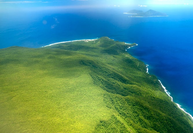 View of the Manu'a Islands with the volcanic islands of Ofu and Olosega (background), and Ta'u (foreground). Image, NPS, public domain