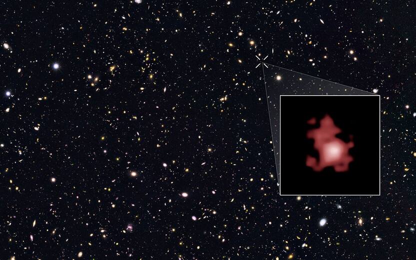 This image shows the position of the most distant galaxy discovered so far within a deep sky Hubble Space Telescope survey called GOODS North (Great Observatories Origins Deep Survey North). The survey field contains tens of thousands of galaxies stretching far back into time. The remote galaxy GN-z11, shown in the inset, existed only 400 million years after the Big Bang, when the Universe was only 3 percent of its current age. It belongs to the first generation of galaxies in the Universe and its discovery provides new insights into the very early Universe. This is the first time that the distance of an object so far away has been measured from its spectrum, which makes the measurement extremely reliable. GN-z11 is actually ablaze with bright, young, blue stars but these look red in this image because its light was stretched to longer, redder, wavelengths by the expansion of the Universe.