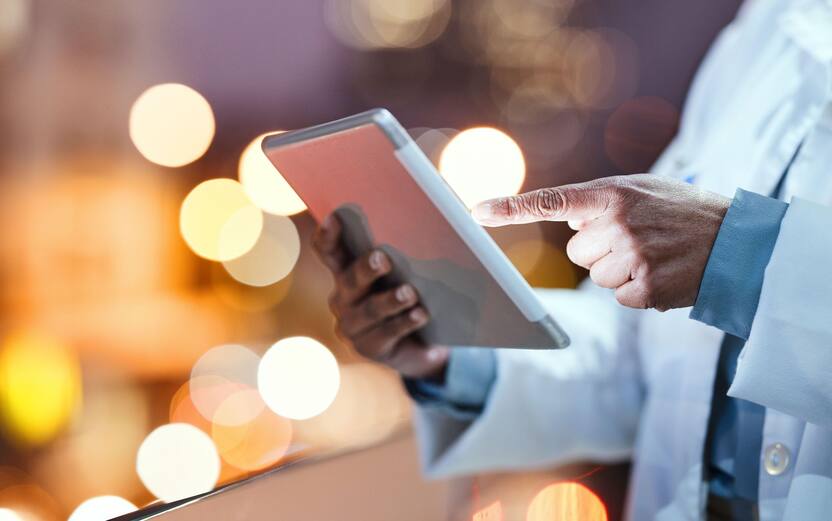 Doctor, tablet and healthcare hands at night for research, consultation and online medical information. Hospital man with technology for health