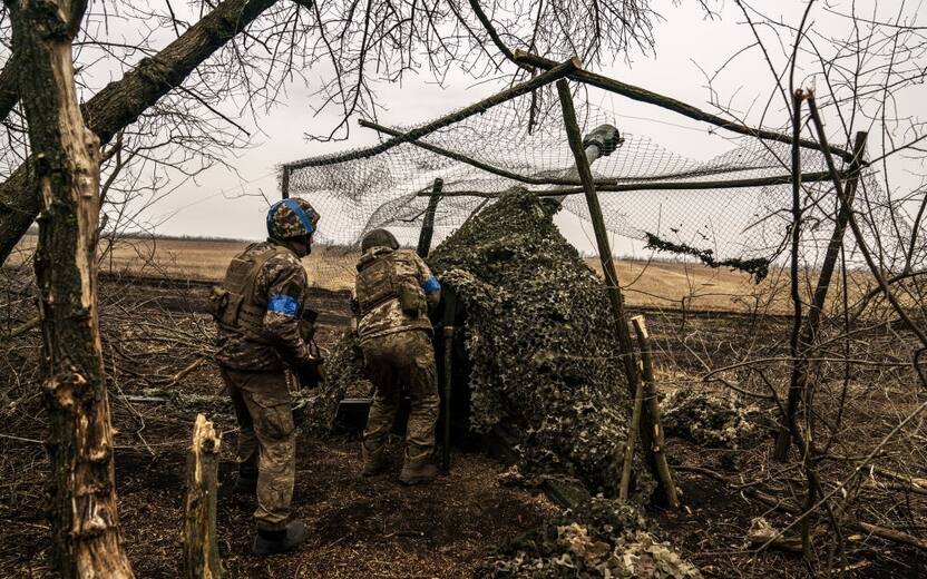 ADIIVKA, DONETSK OBLAST, UKRAINE - MARCH 13: Ukrainian soldiers at the artillery position in an unidentified area on the Adiivka frontline prepare to fire the D 30 gun as the war between Russia and Ukraine continues in Adiivka, Donetsk Oblast, Ukraine on March 13, 2024. (Photo by Jose Colon/Anadolu via Getty Images)