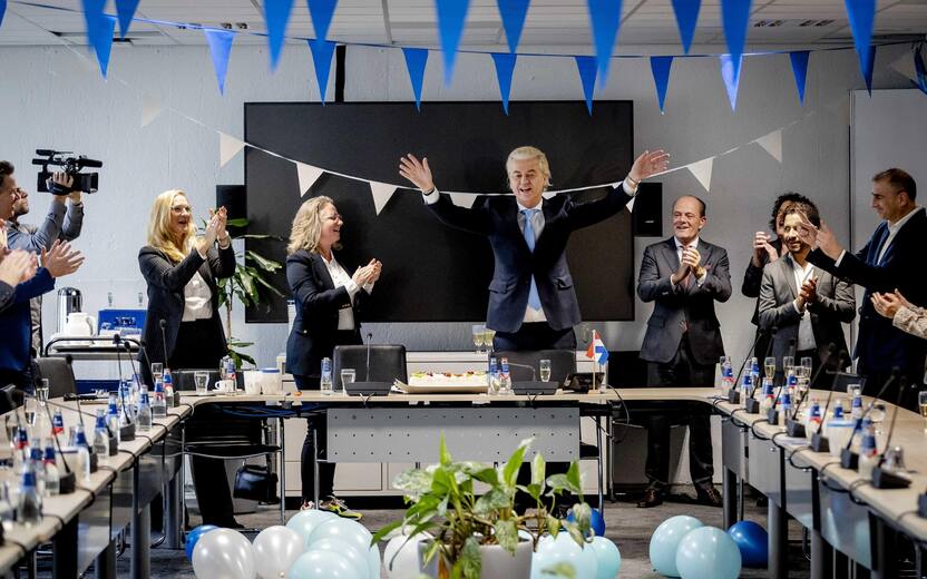 epa10990601 Leader of Freedom party (PVV) Geert Wilders (C-R) gestures next to Dutch MP Fleur Agema (C-L) one day after the House of Representatives elections, The Hague, Netherlands, 23 November 2023. Wilders believes that the PVV can no longer be ignored after the "mega victory" in the House of Representatives elections. He calls on other parties to work together and step over their own shadows. The PVV party is set to win the parliamentary elections with 37 seats after most votes were counted. EPA/REMKO DE WAAL