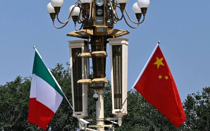 Italy's national flag (L) flutters beside the Chinese flag outside Tiananmen Square, during the official visit of Italian Prime Minister Giorgia Meloni in Beijing on July 28, 2024. (Photo by Pedro PARDO / AFP) (Photo by PEDRO PARDO/AFP via Getty Images)